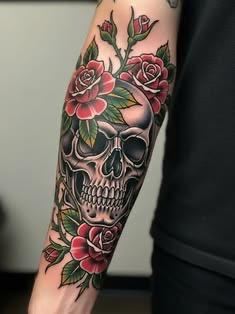 Neo-traditional skull and roses forearm tattoo